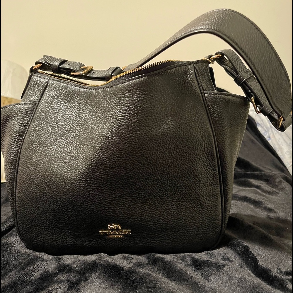 Black leather top zip Coach shoulder bag.